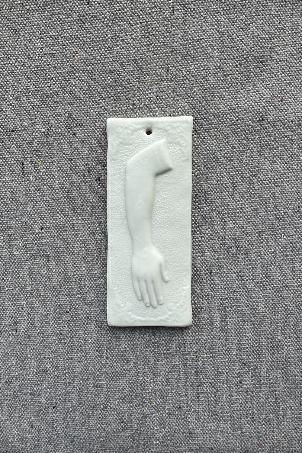 ceramic wall ornament - sq arm